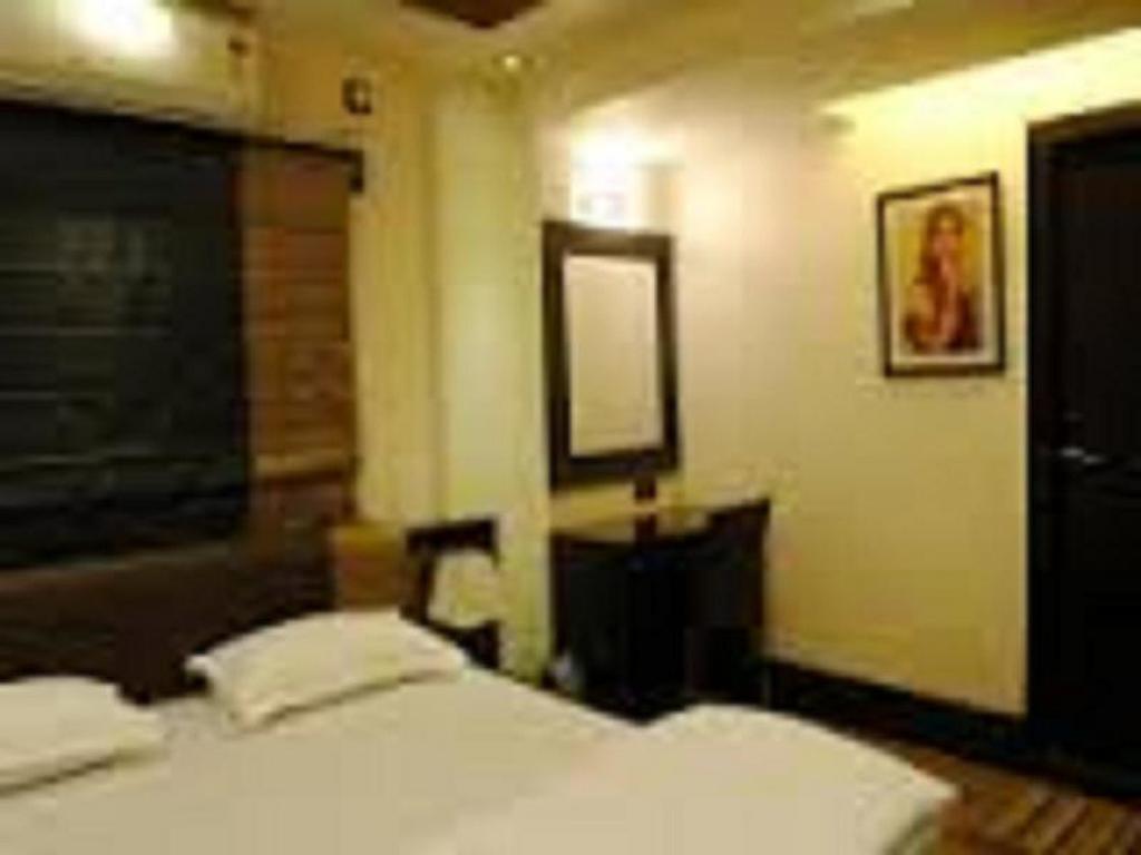 Tangerine Guest House Calcuta Habitación foto